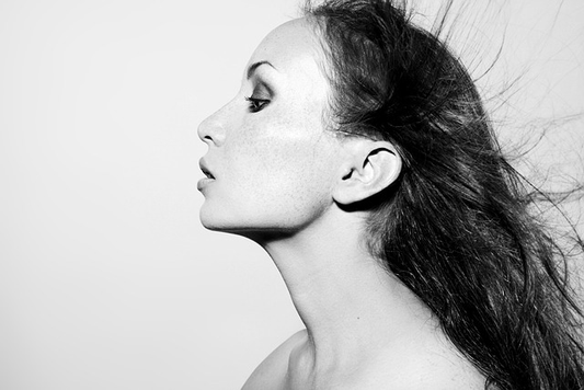 black and white picture of a woman with long hair.