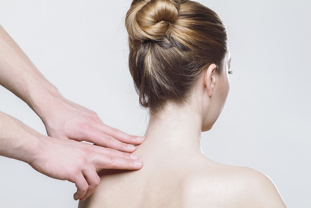 woman getting a massage on her shoulders.