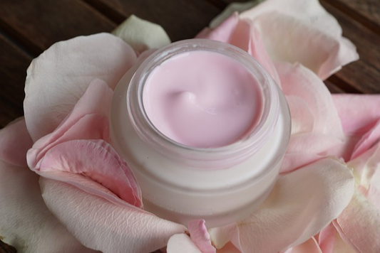 bottle containing pink colored serum.