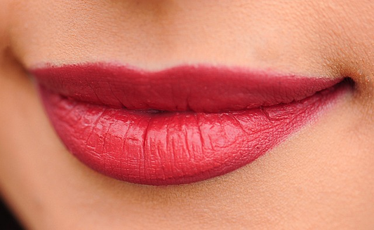 pink lips with red lipstick on them.